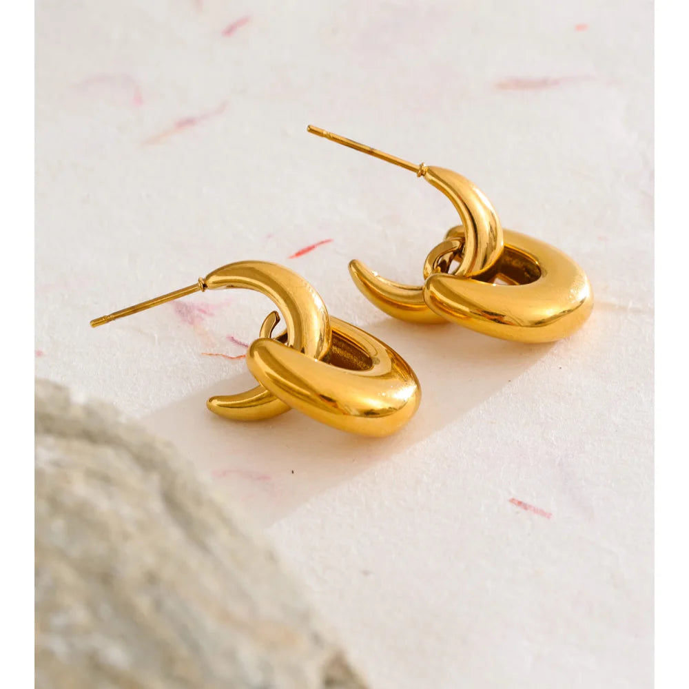 Modern ear rings with bold U shape and golden shine