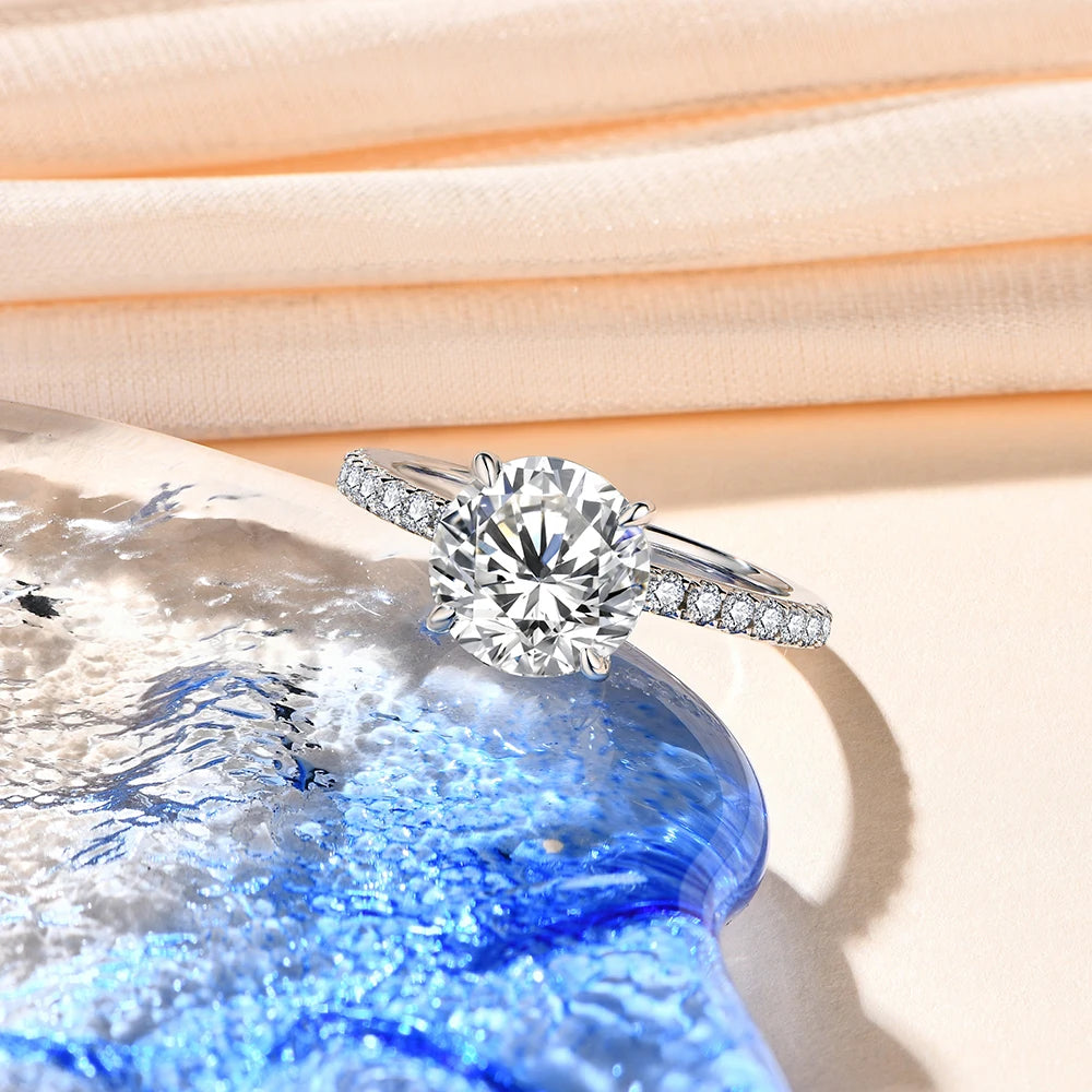 Classic moissanite ring paired with rings with moissanite for a polished set