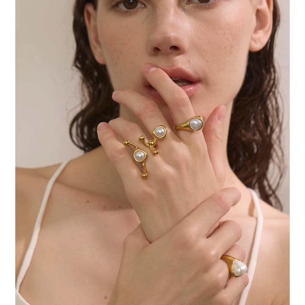 Elegant a pearl ring styled within rings gold rings stacking