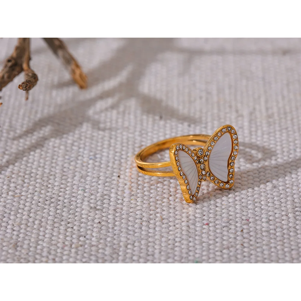 Gold ring design featuring rings with cubic zirconia in a butterfly ring style