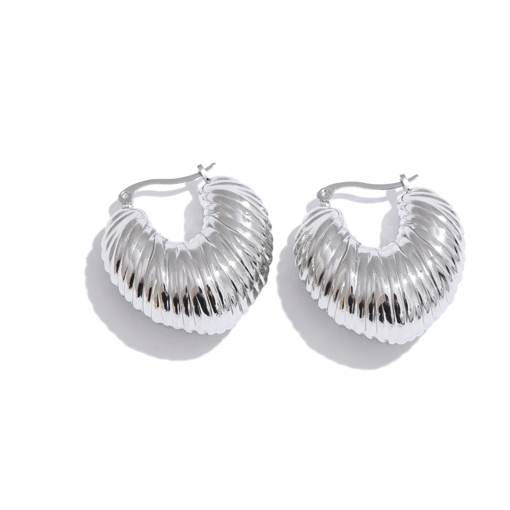 Side angle of stainless steel jewelry hoops with reflective glow