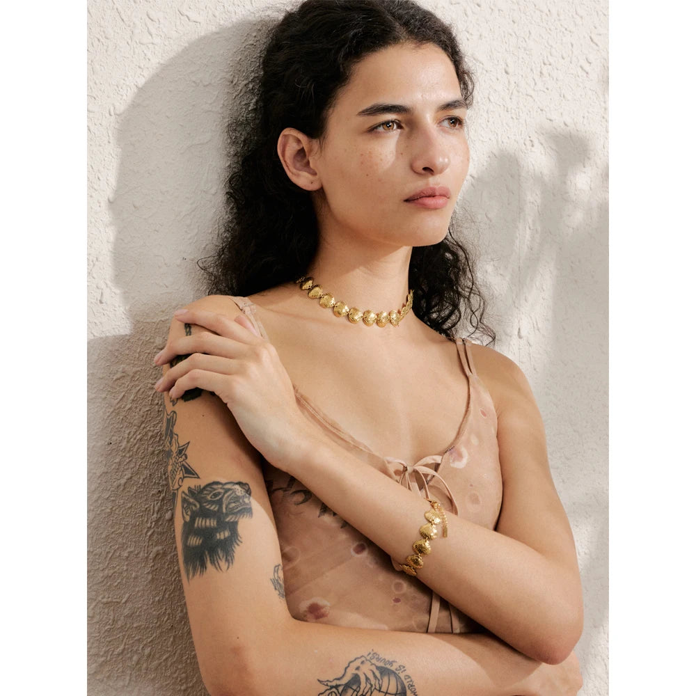 Close-up of gold necklace in stainless steel jewelry design