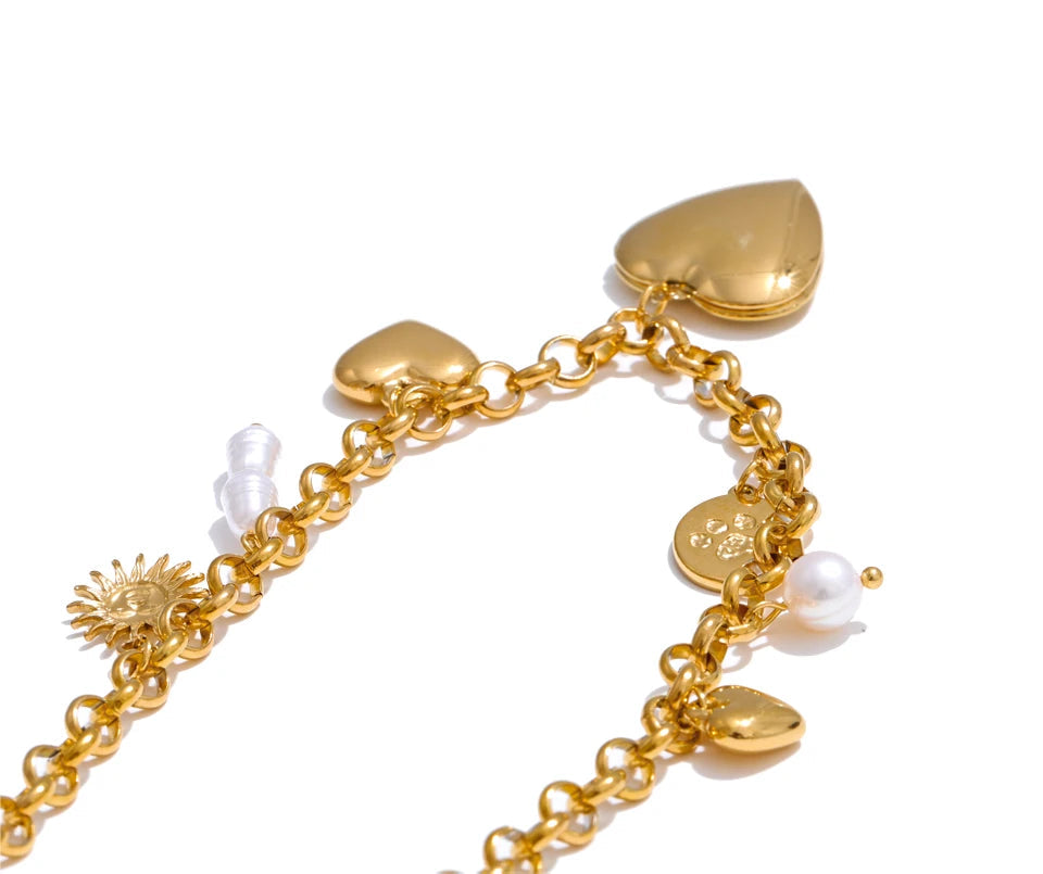 Minimal studio photo of heart jewelry pendant in gold plated stainless steel