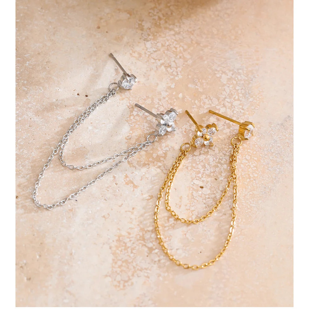 Elegant gold earrings with cubic zirconia flower drop design