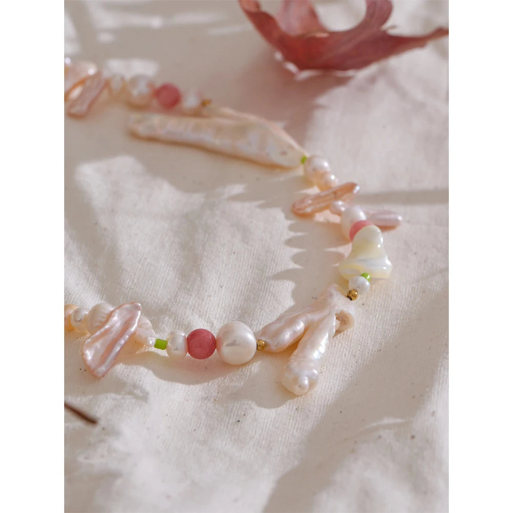 Close-up of pearl on necklace showing detailed gold chain design