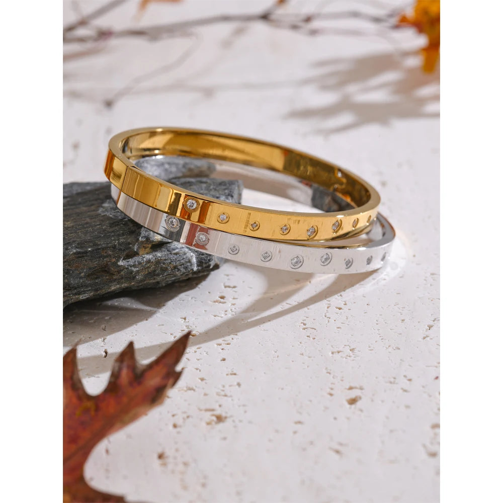 Close-up of gold bracelet bangle with stainless steel jewelry finish