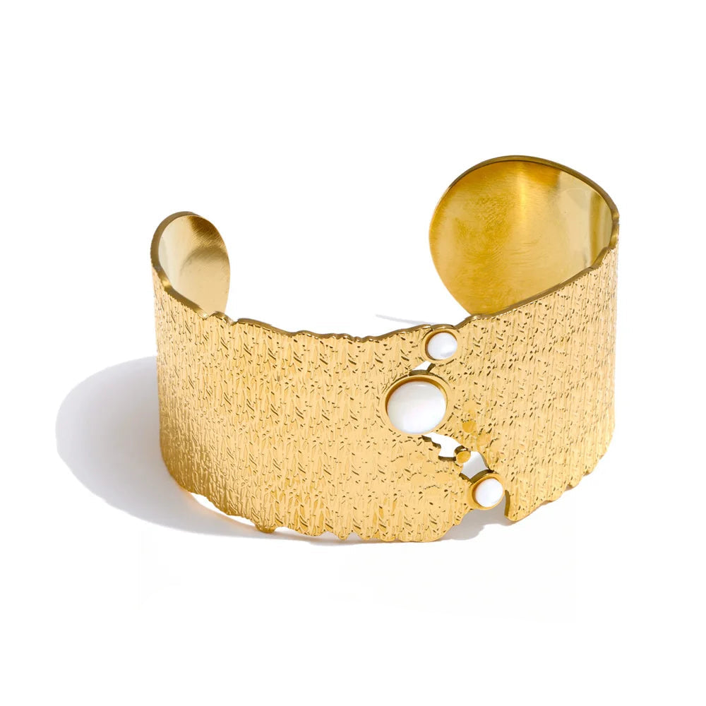 Wide shell cuff bracelet in gold jewelry with gold plated shine