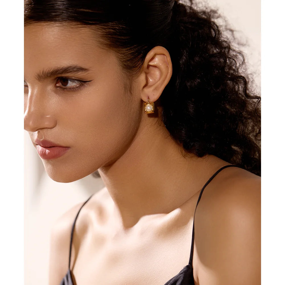 Close view of earrings pearl glow on vintage hoop earrings