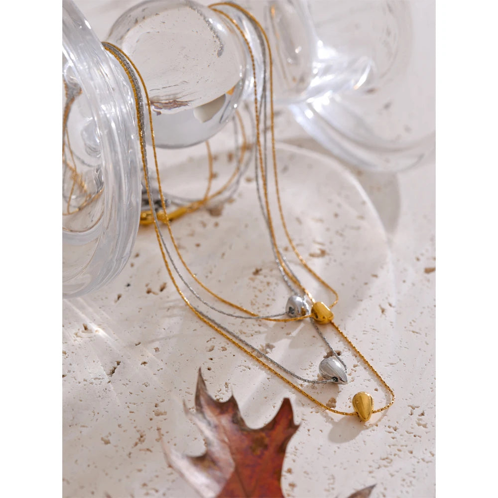 Clean background photo of stainless steel jewelry chain with pendant on a necklace