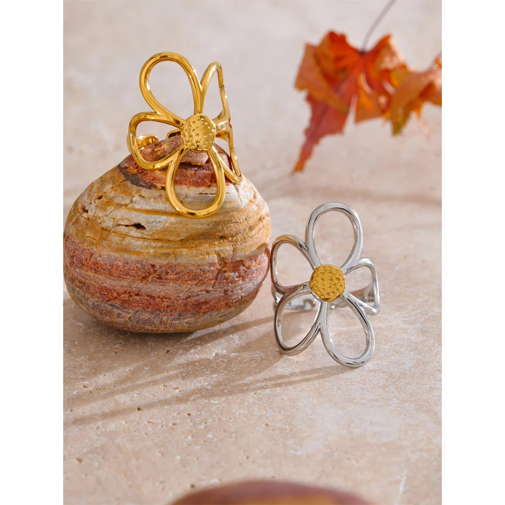 Stackable flower ring paired with other finger ring accessories for daily layering