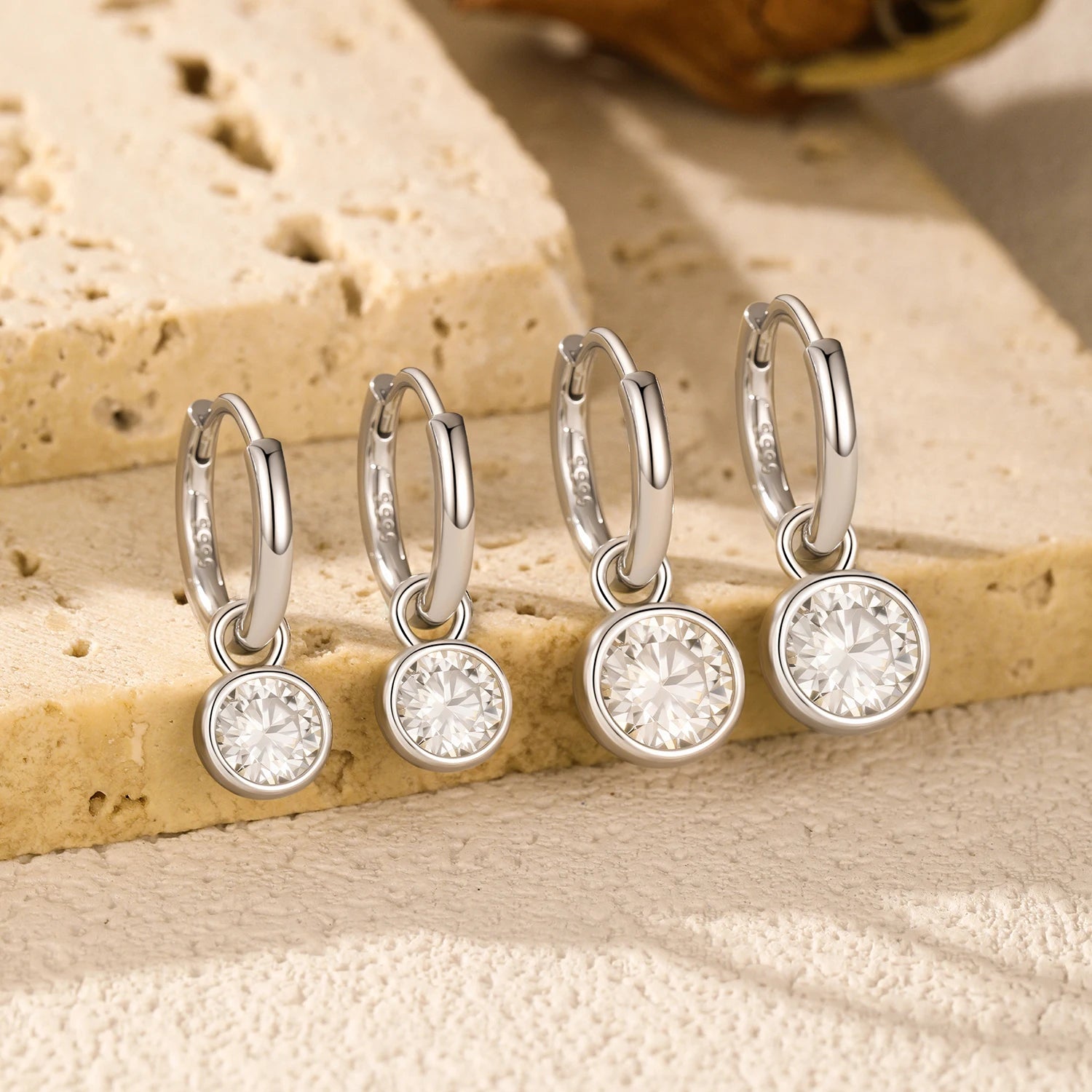 Round moissanite jewelry set in sterling silver hoops