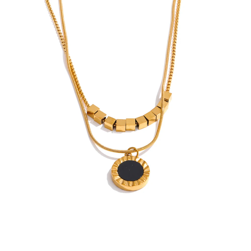 Layered shell and black acrylic pendant necklace in gold plated stainless steel jewelry