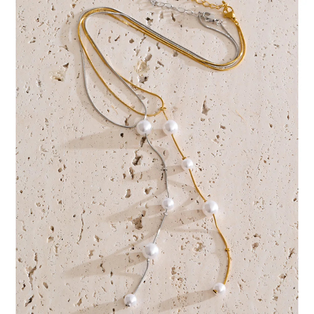 Stainless steel jewelry necklace with soft pearl accents