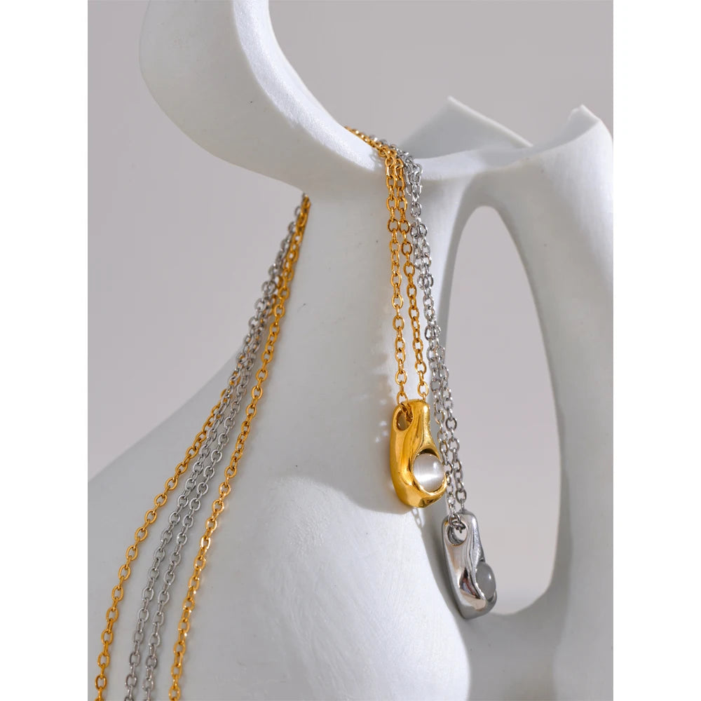 Stainless steel jewelry chain holding a geometric pendant for a necklace