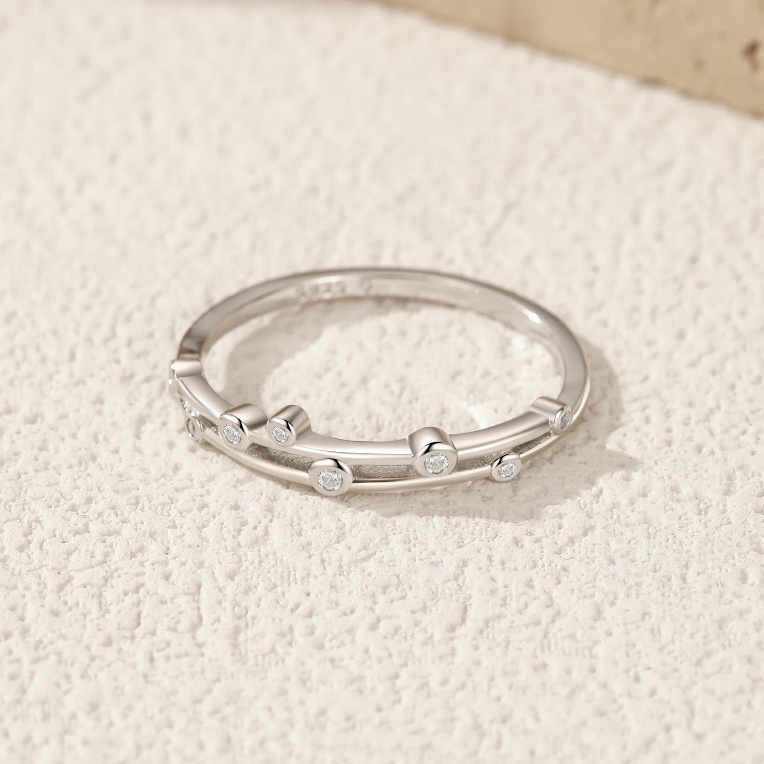 Double layer cocktail ring with round clear CZ and silver band