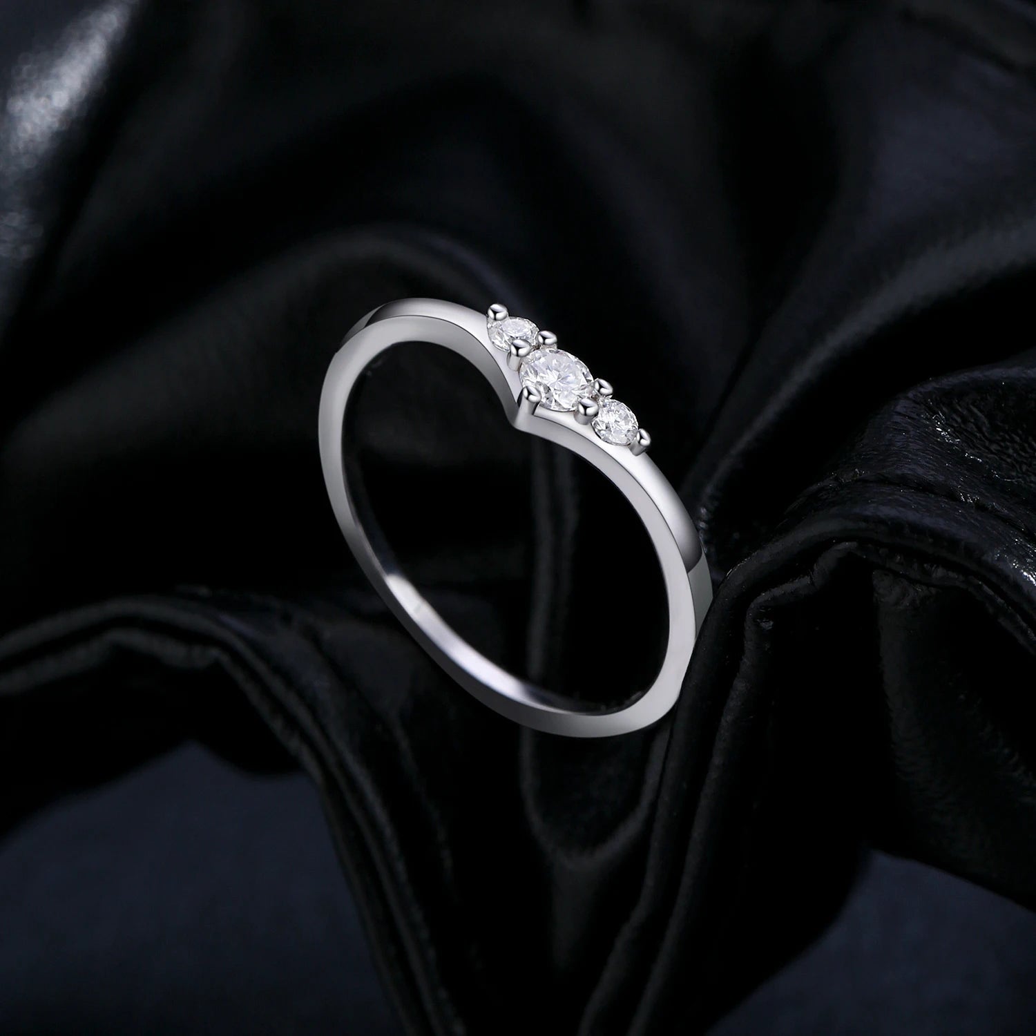 Rings with moissanite set on a polished silver ring band