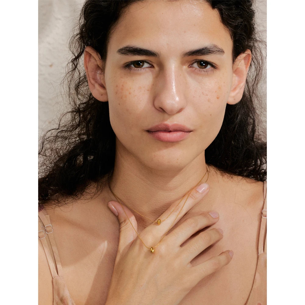 Fashion image featuring necklaces gold necklaces with a cast pendant center