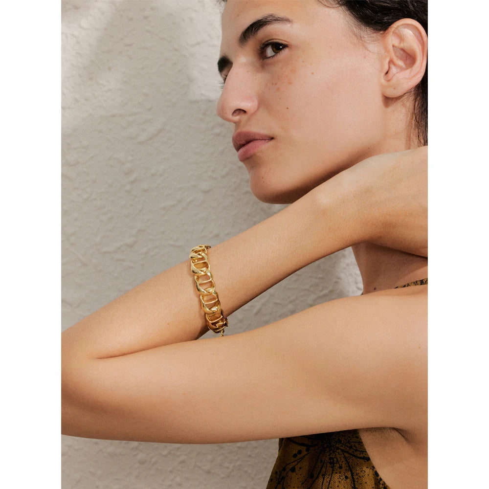 Stack idea mixing wide chain with a bracelet charm bracelet accent