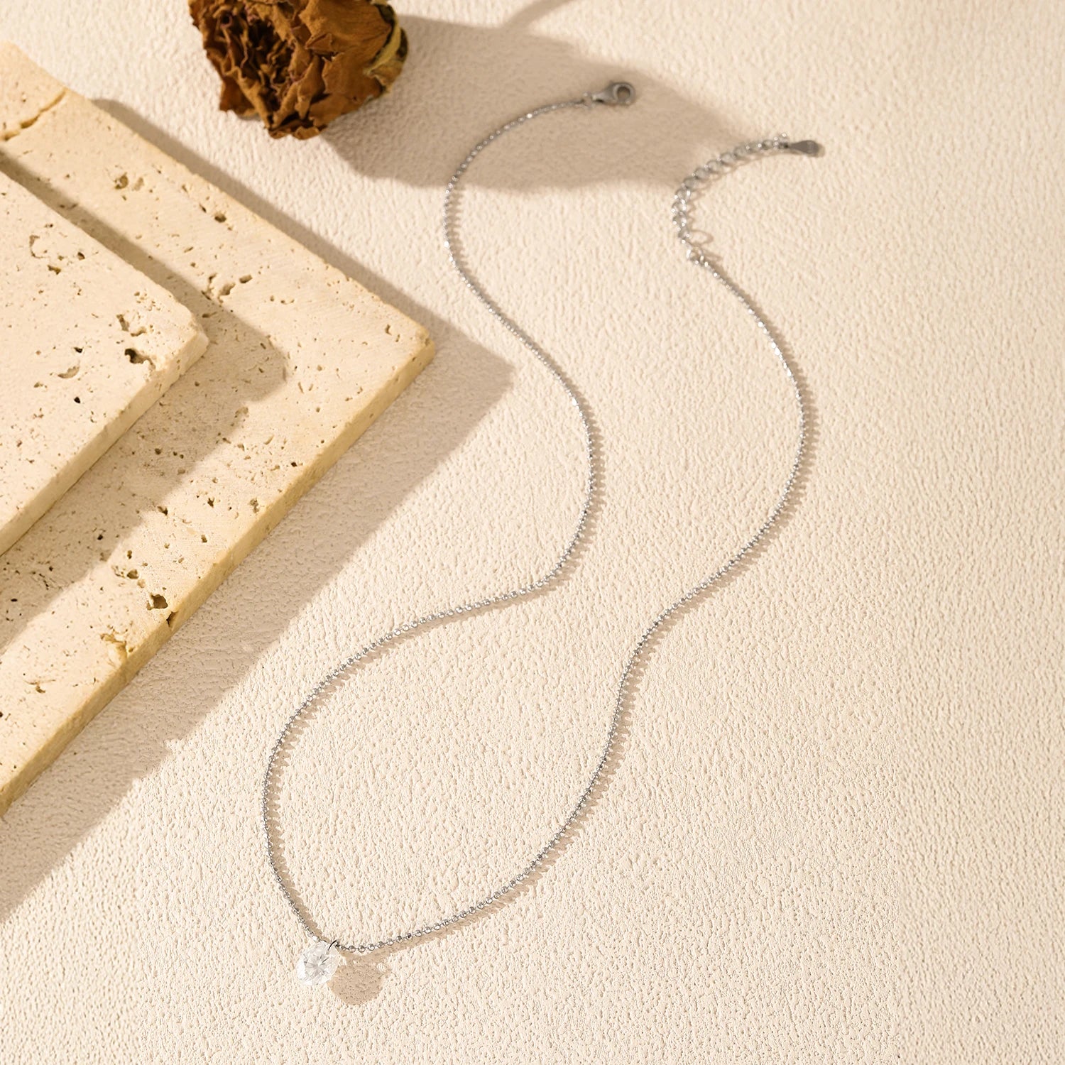 Women necklace combining moissanite jewelry charm with silver chain