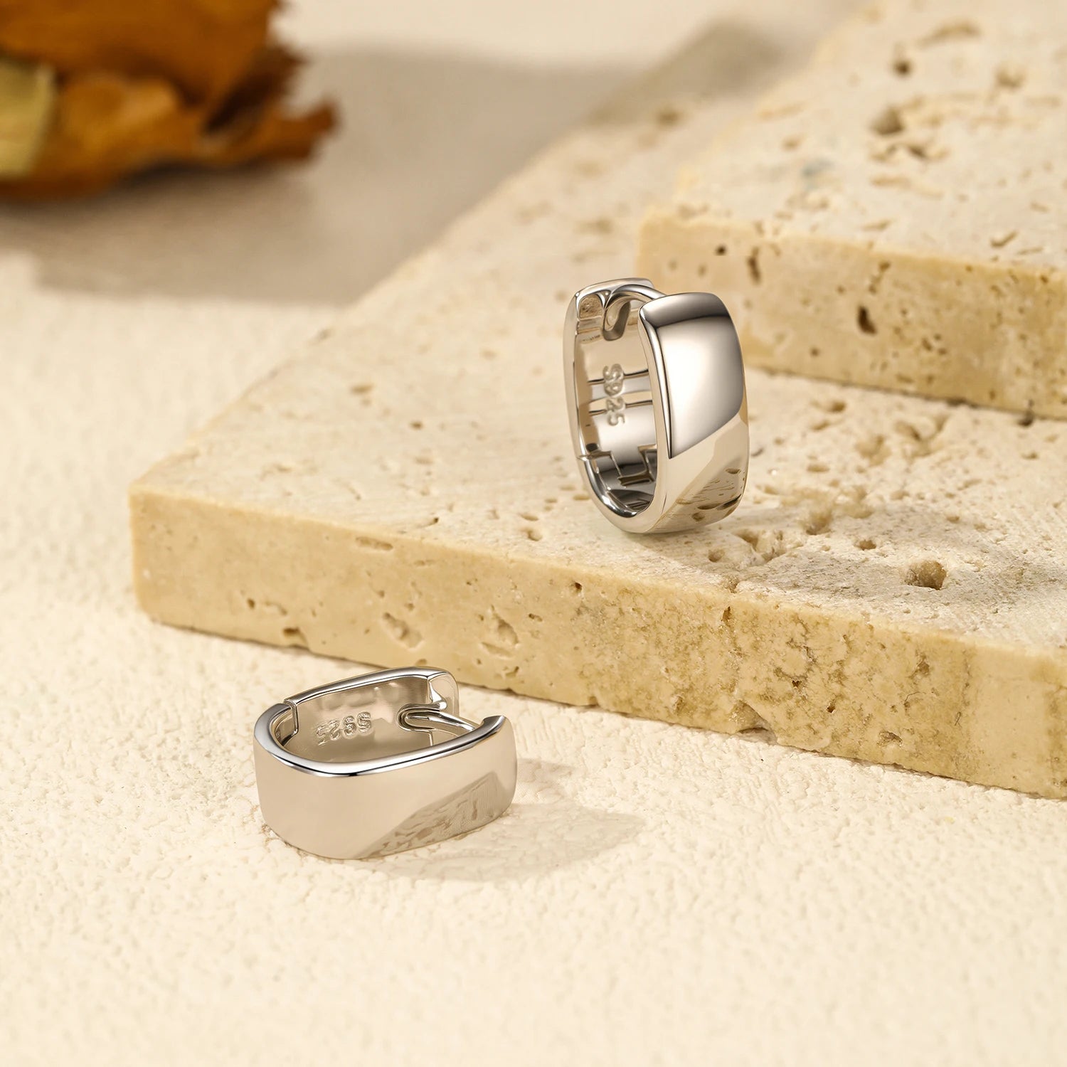 Hoop earrings for women styled with a simple silver necklace