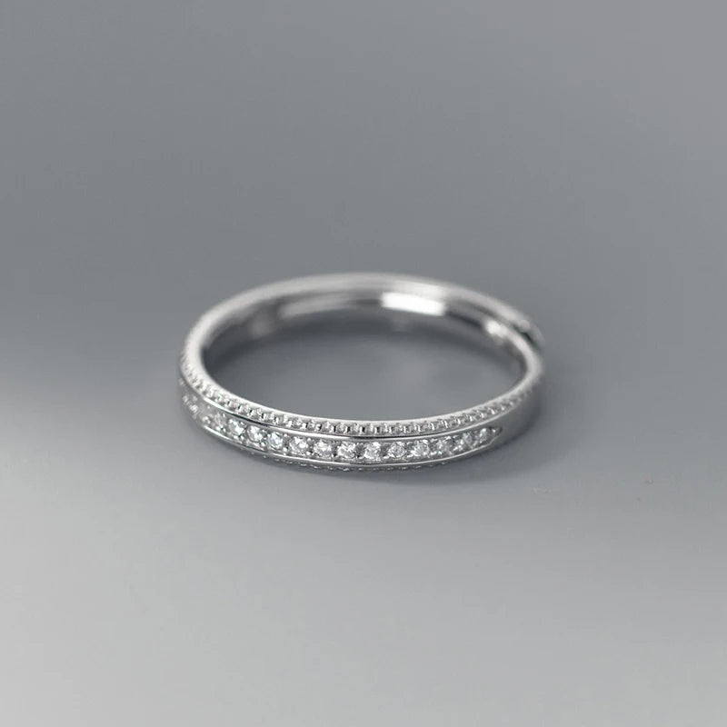 A wedding ring beside a coordinated wedding band ring