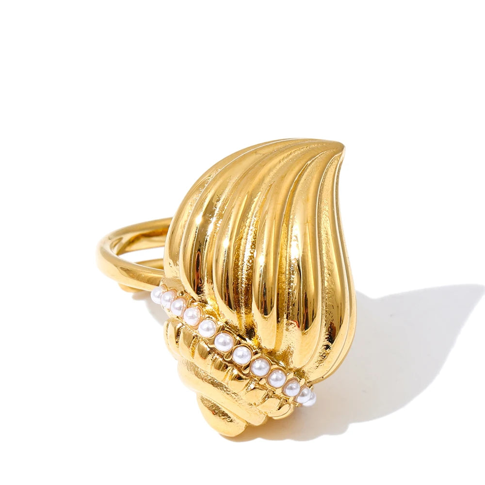 Macro detail of pendant on necklace surface beside luminous pearls for necklace