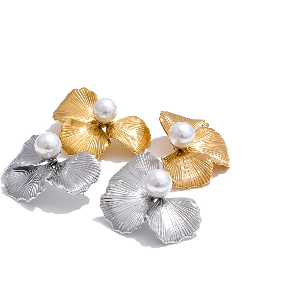 Editorial portrait featuring earrings gold earrings with delicate floral texture