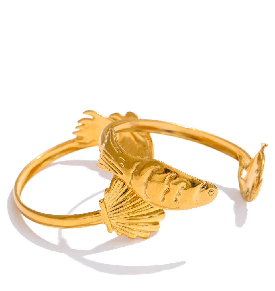 Gold plated cuff reflecting warm light as a gold bracelet bangle