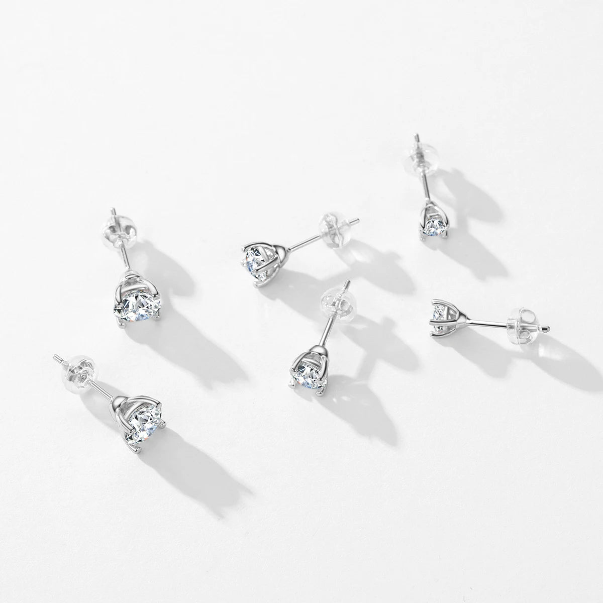 Ear rings display featuring classic stud earrings with 1CT and 2CT stones
