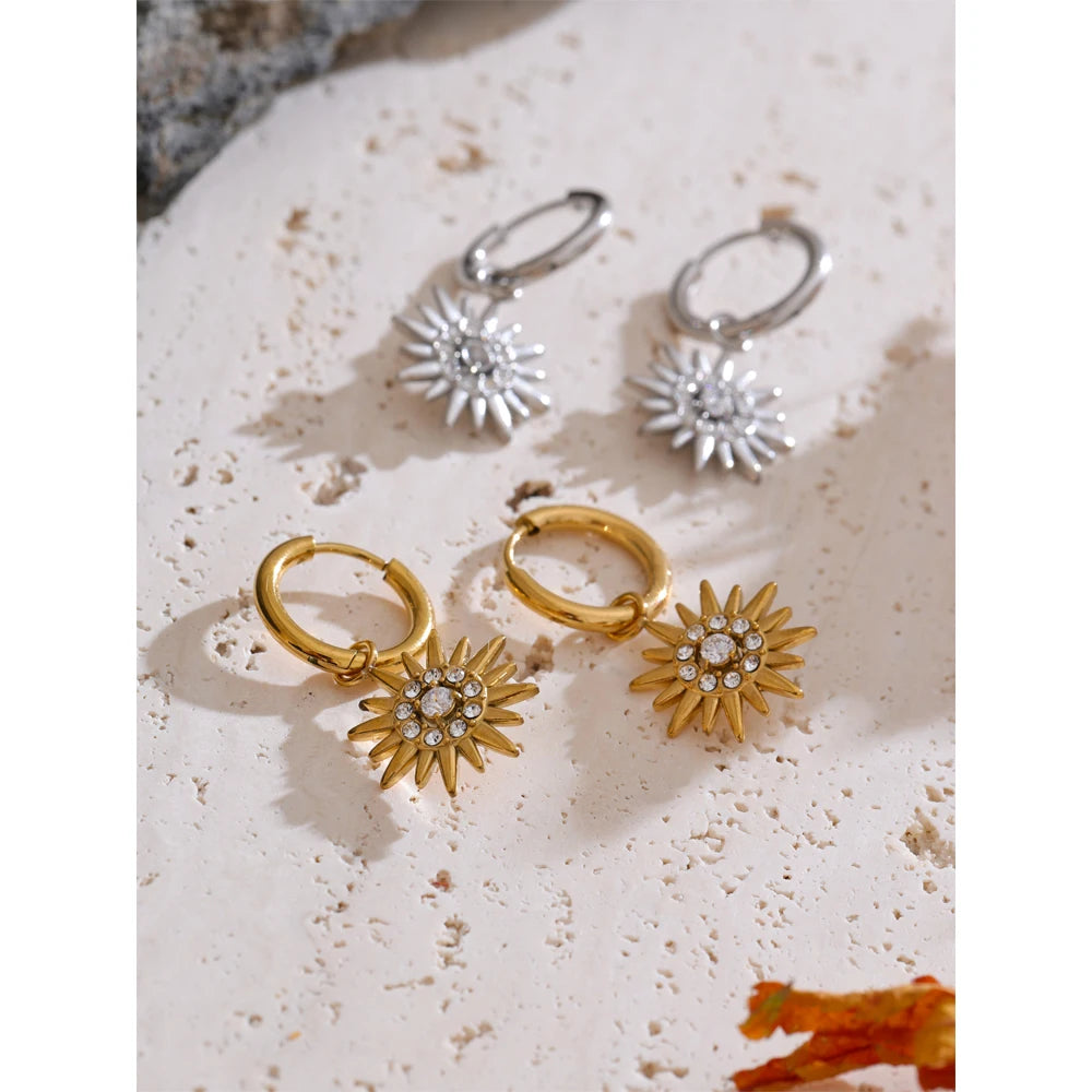 Close-up of gold hoop earrings for women with sparkling zirconia