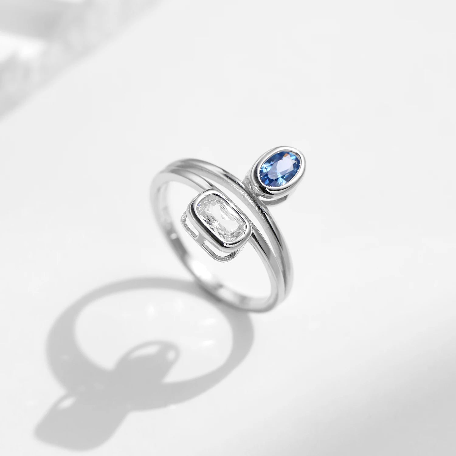 Close view of sterling silver ring featuring emerald cut facets