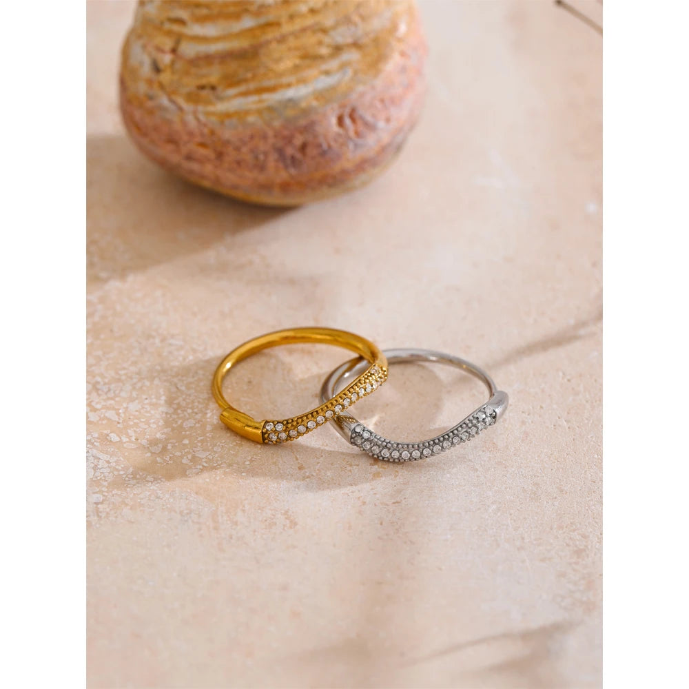 Finger and ring styling with gold plated thin ring and subtle cubic zirconia detail