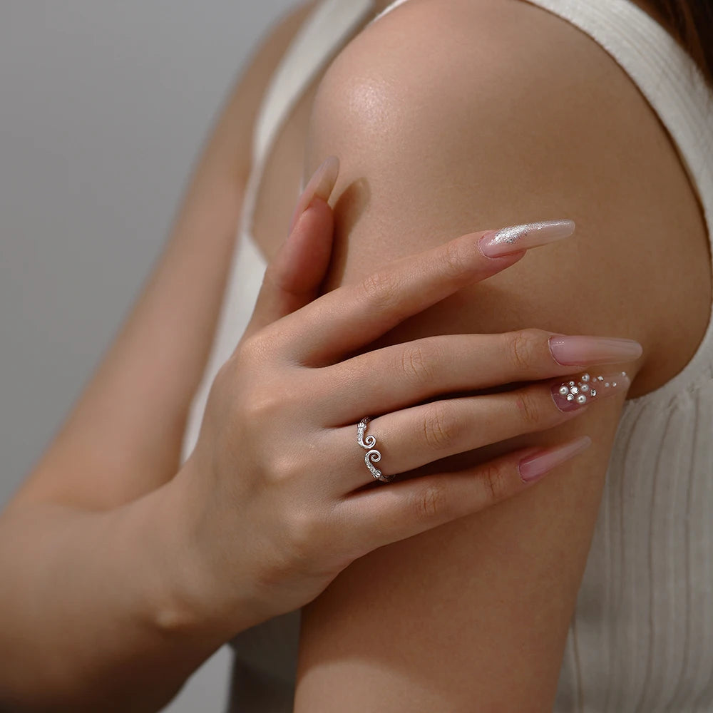 Stylish sterling ring stacked with gold rings gold for contrast