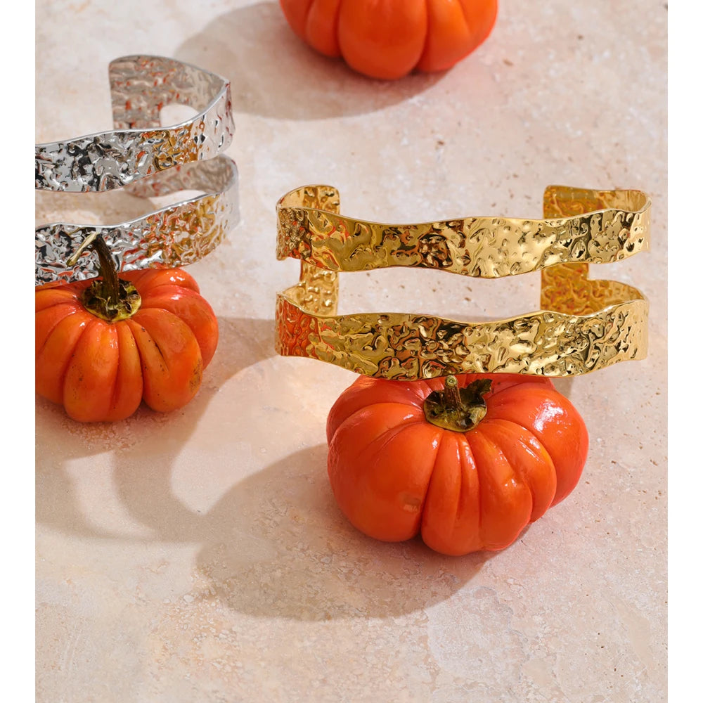 gold bracelet cuff featuring hammered metal and modern design