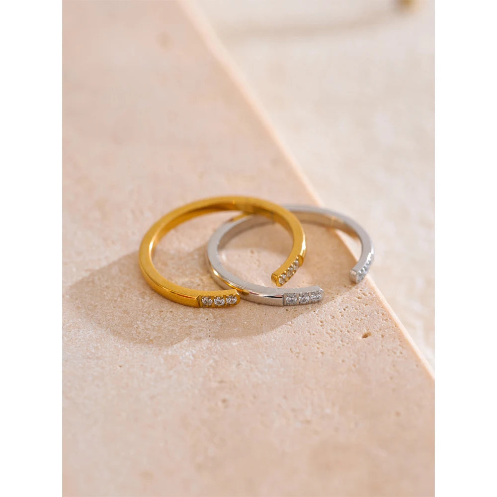 Finger with a ring styled in rings gold rings with the adjustable open zirconia ring