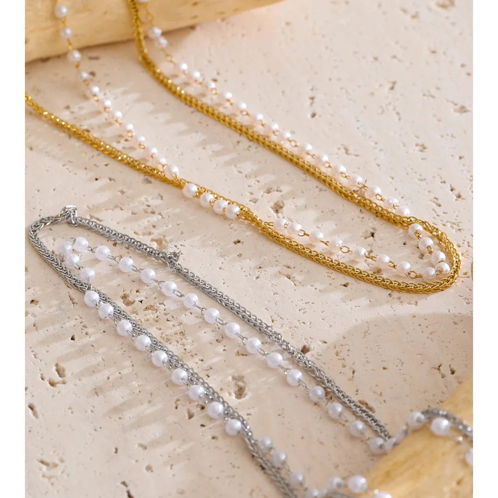 Close up of pearl on a necklace with elegant chain overlay