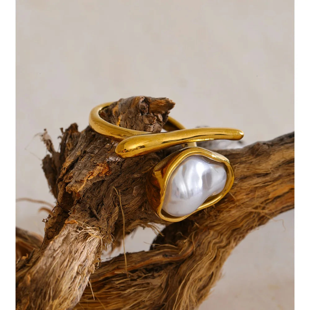 Ring with gold finish and baroque pearl accent