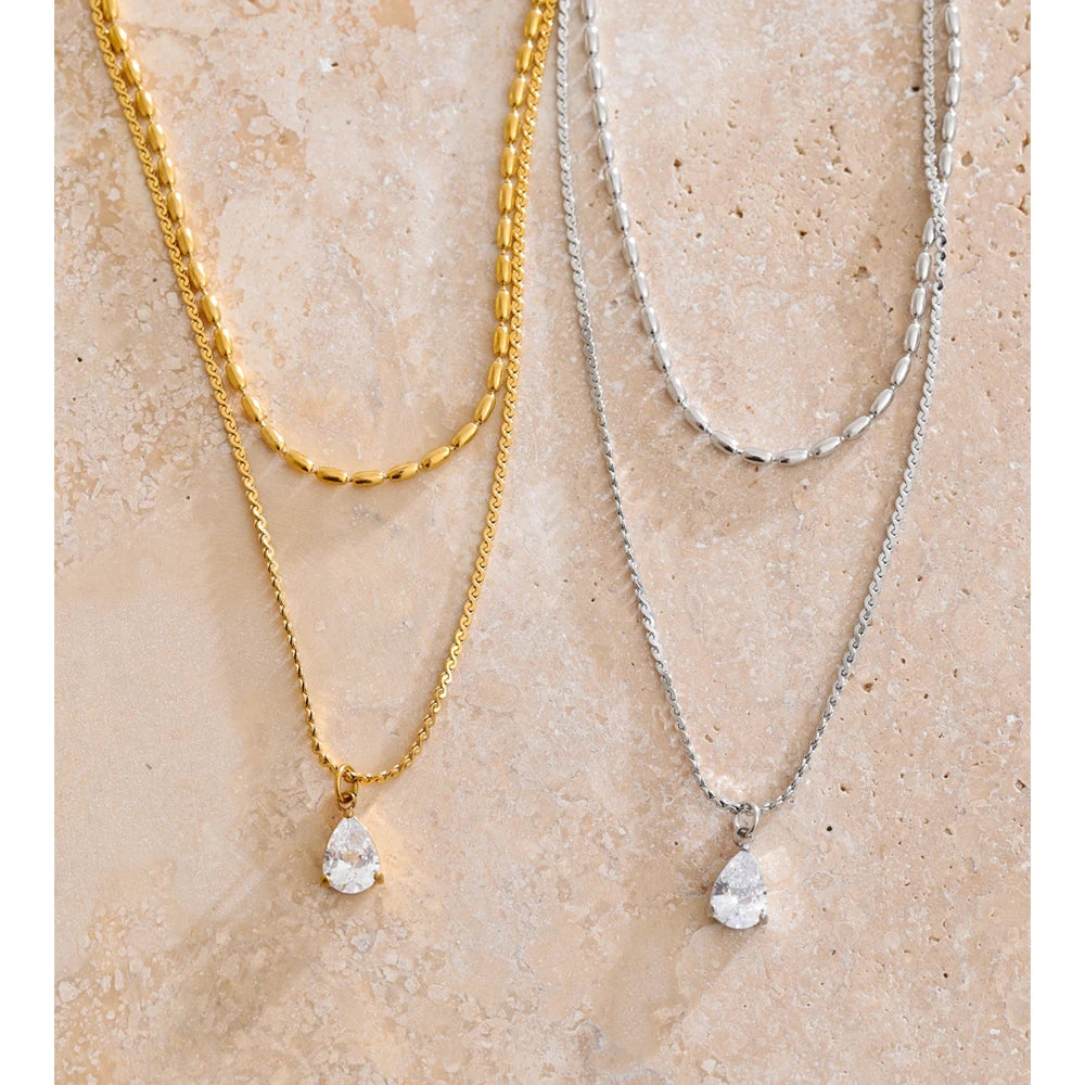 Elegant pendant necklace featuring layered stainless steel chains