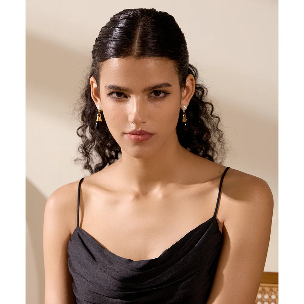 Black crystal drop earrings styled as stainless steel earrings