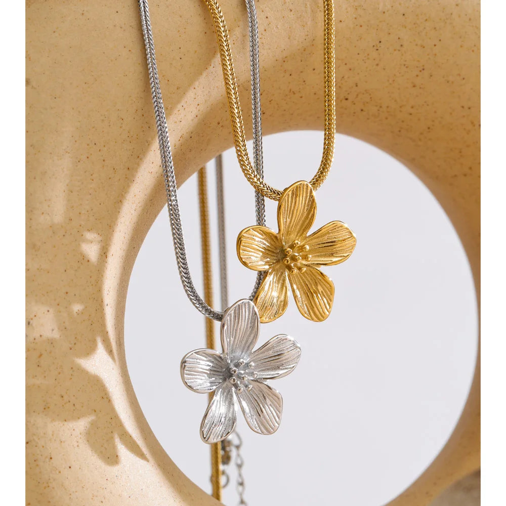 Close up of flower necklace gold plated jewelry detail