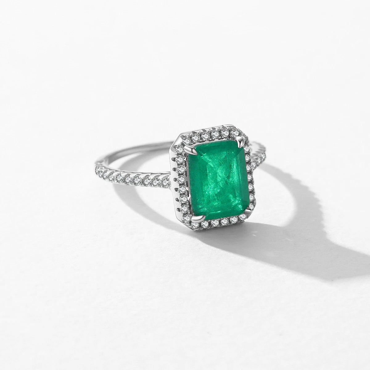 Classic sterling ring highlighting a bright emerald cut profile