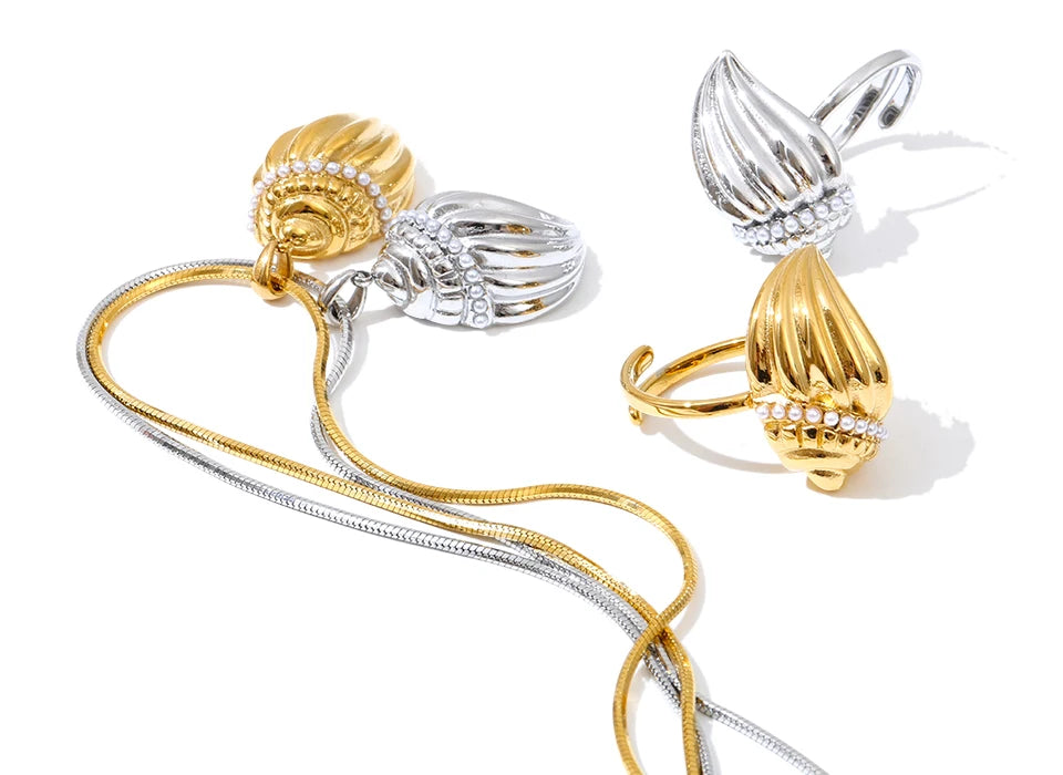 Lifestyle photo layering necklace and necklace with a seashell look and necklace pearls