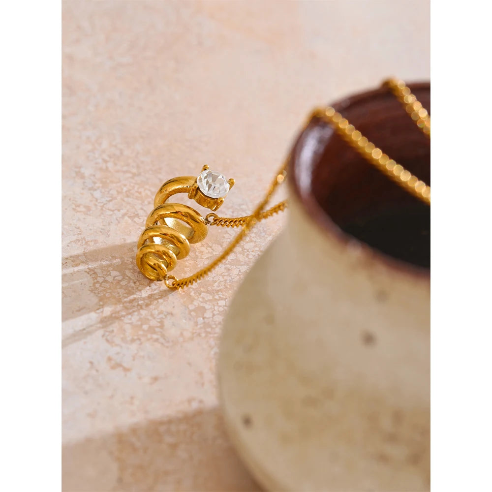 Close view of pendant necklace with necklace golden necklace glow and cubic zirconia