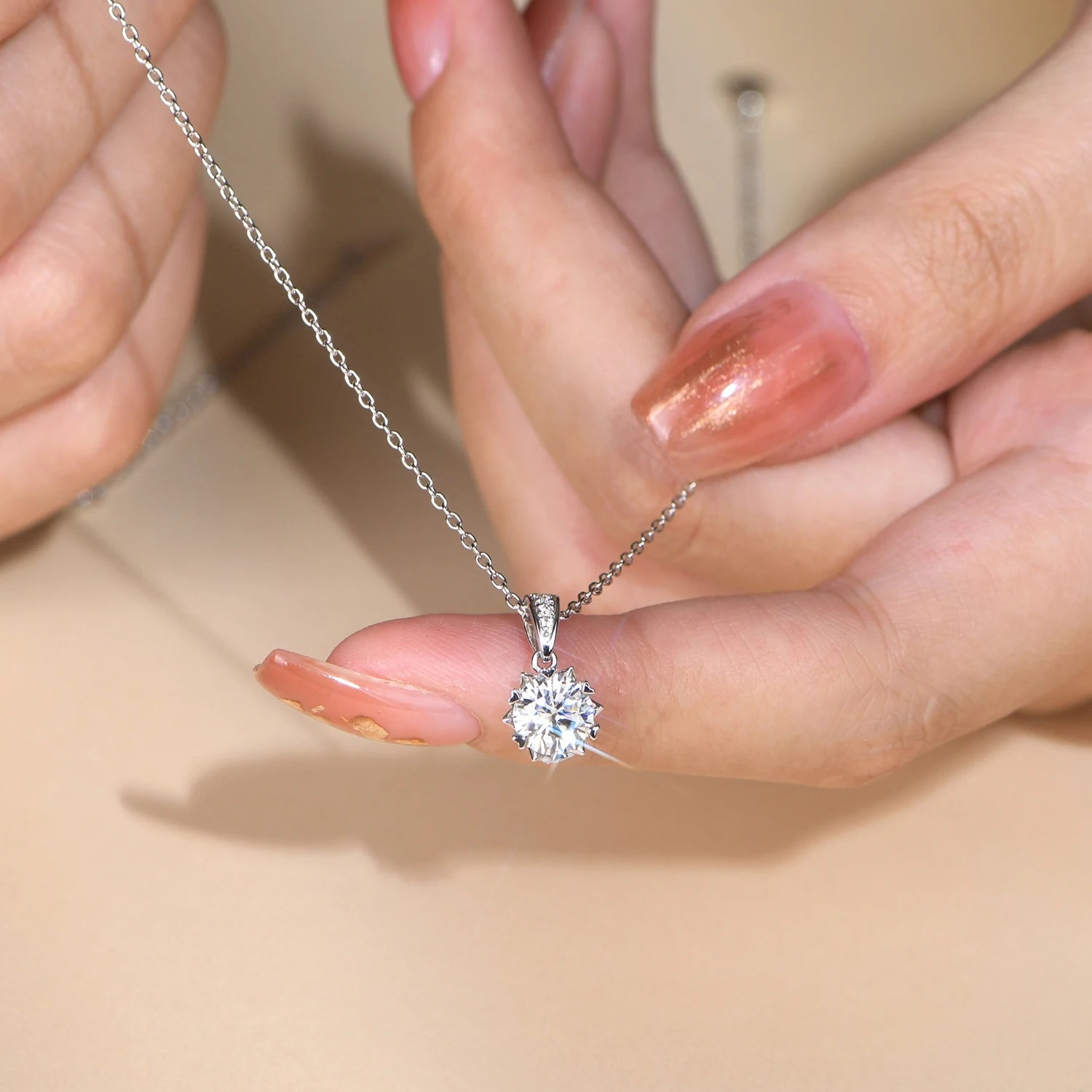 Pendant necklace styled as a long necklace with elegant moissanite chain