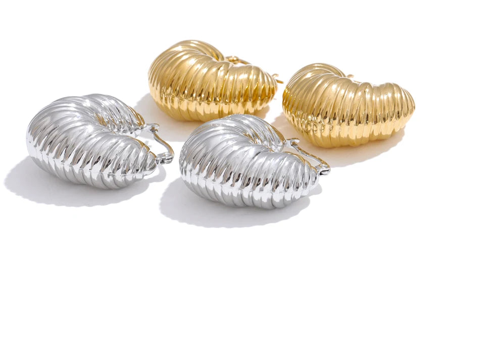 Macro detail of gold plated finish on chunky earrings gold profile