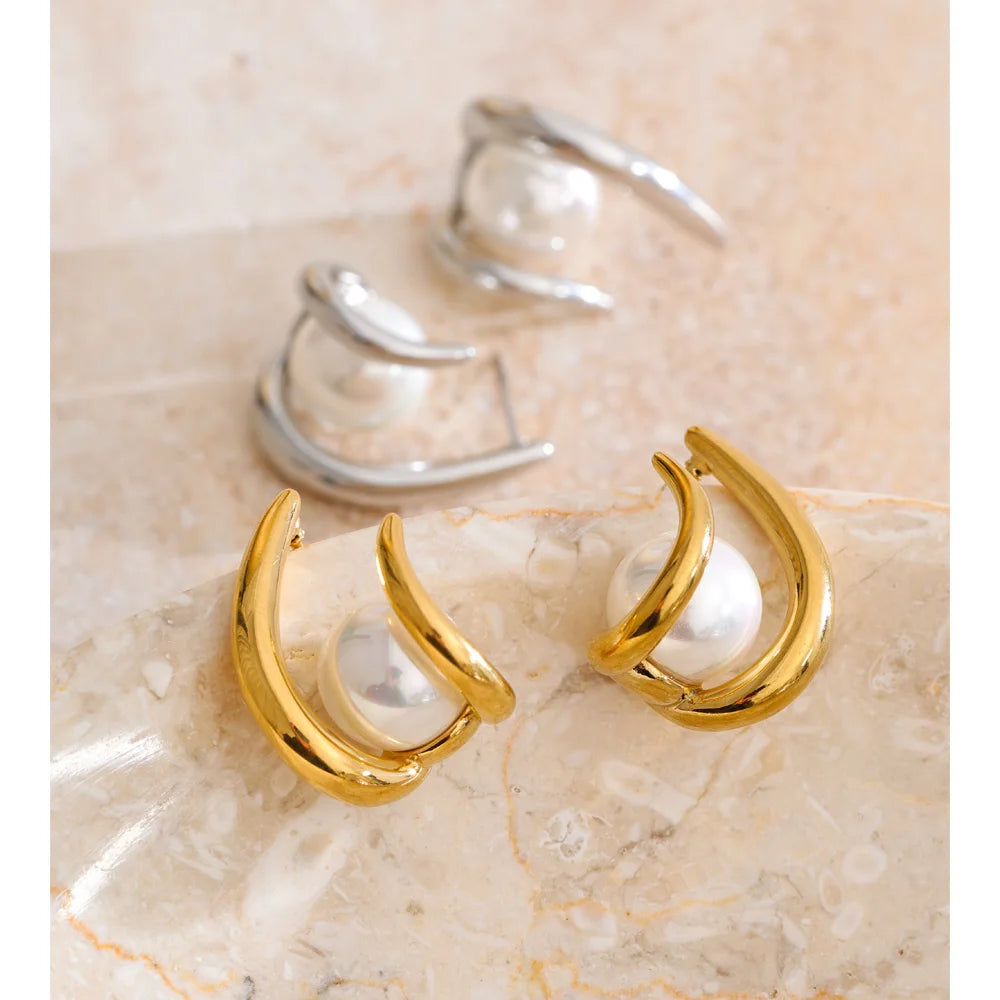 Elegant gold earrings with pearl accents in hoop design