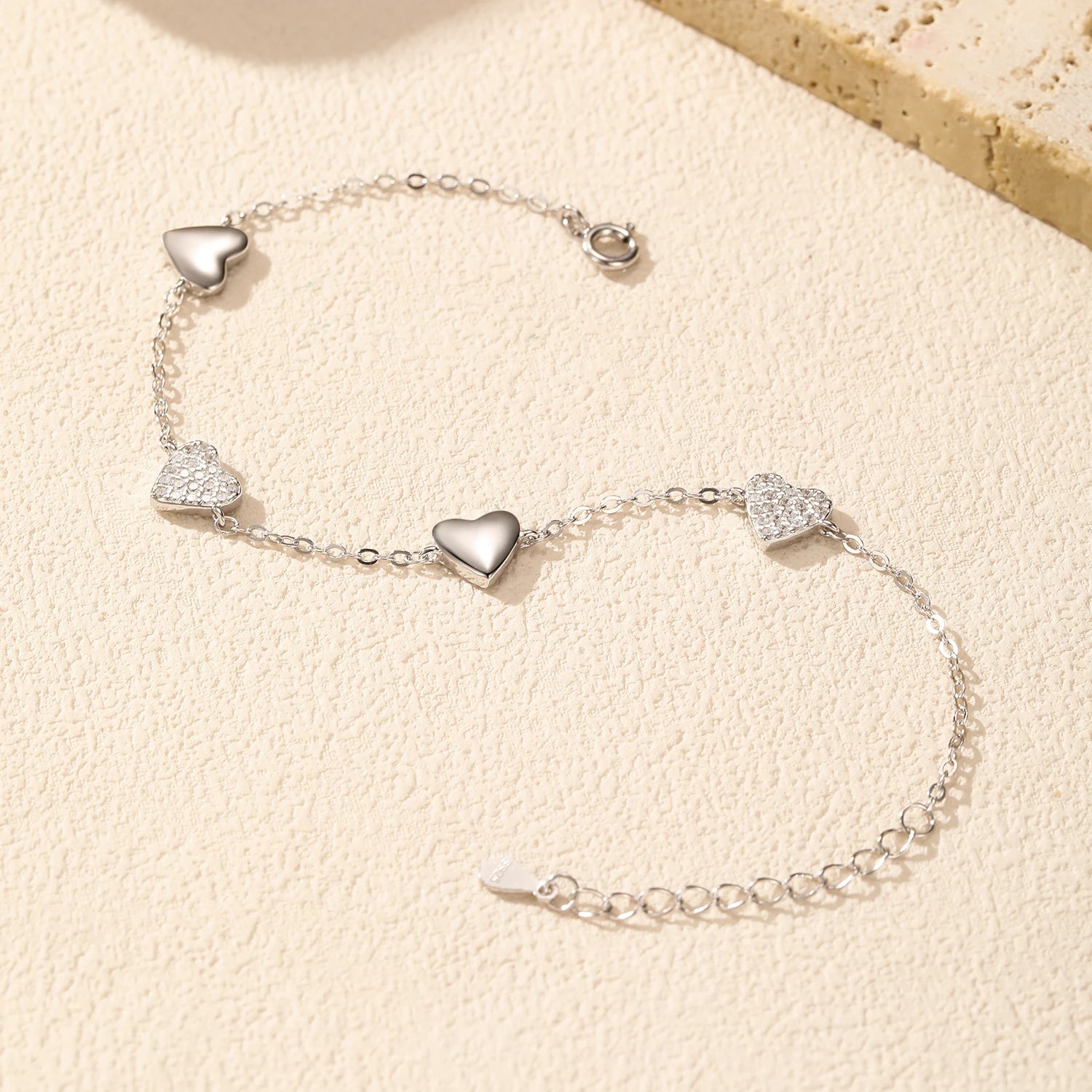 Bracelet and charms piece with delicate mirror hearts accents