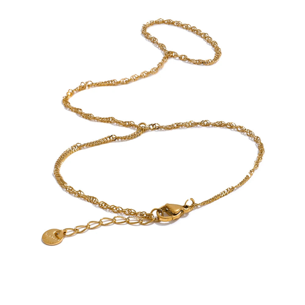 Classic bracelet chain with link ring joining a gold bracelet bangle in stainless steel jewelry