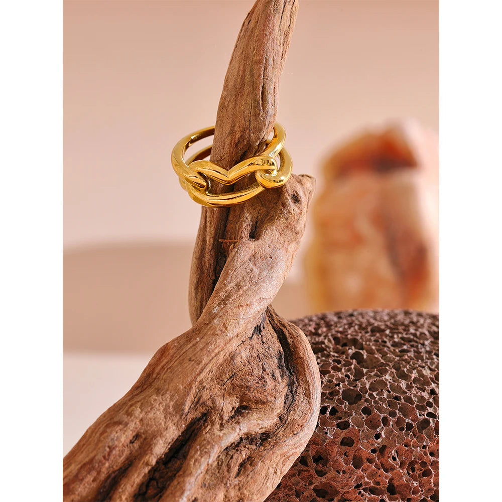 Lustrous gold ring highlighting a graceful gold heart accent