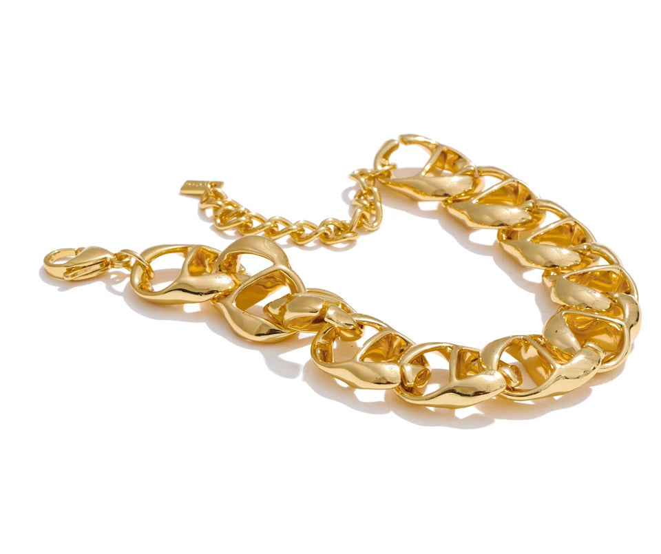 Clean background image of gold plated wide chain for women with bracelet looks